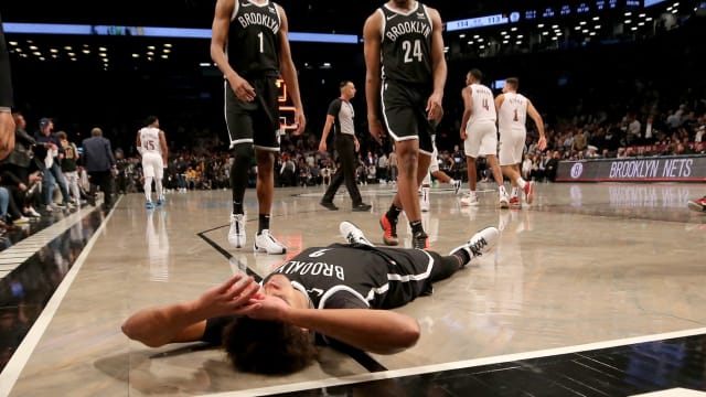 Brooklyn Nets forward Mikal Bridges (1) and guard Cam Thomas (24) walk towards forward Cameron Johnson (2)